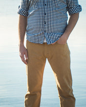 Load image into Gallery viewer, Close-up view of man wearing yellow Fulford Jeans at hip level. Shows contrasting colour topstitching across pockets and fly zip seams.
