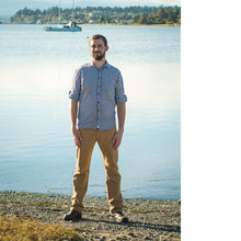 Load image into Gallery viewer, Man stands in front of lake wearing straight leg Fulford Jeans in a yellow colour denim.
