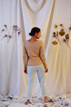 Load image into Gallery viewer, Back view of lady standing, wearing Hussard jeans showing rolled up hems.
