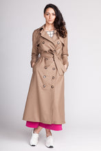 Load image into Gallery viewer, Lady wearing the Isla Trench Coat fastened with buttons and belt.
