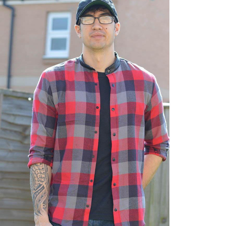 Man wears Jensen Shirt with stand collar and snap fastenings in flannel fabric.