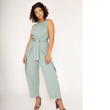 Load image into Gallery viewer, Lady wears mint green jumpsuit tied at front waist.
