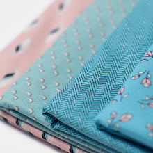 Load image into Gallery viewer, Set of four fabrics in various blue and pink colour patterns.
