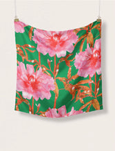 Load image into Gallery viewer, Square piece of fabric hans on suspended clips on top two corners, fabric pattern print of large open blooms on branches
