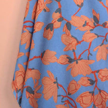 Load image into Gallery viewer, Auguste EcoVero Viscose fabric hangs with soft drape, displaying pattern print of branches with blossoming buds

