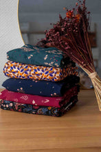 Load image into Gallery viewer, Folded stack of five fabrics of various colours and prints from Lise Tailor designs
