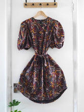 Load image into Gallery viewer, Anthea Dress made with Hilma Rust EcoVero fabric displayed on hanger, with skirt fanned out
