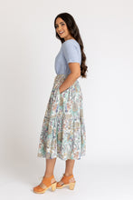 Load image into Gallery viewer, Side view of lady wearing tiered skirt with hand in inseam pocket of skirt
