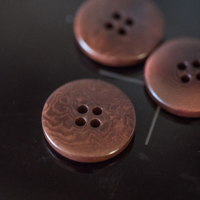 Smooth round corozo buttons with 4-holes
