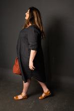 Load image into Gallery viewer, Side view of Lady wearing a knee length Dress Shirt
