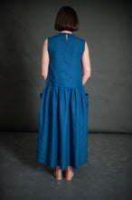 Load image into Gallery viewer, Back view of lady wearing sleeveless Hattie Dress
