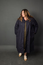 Load image into Gallery viewer, Lady wears duster overcoat unfastened with hands in pockets
