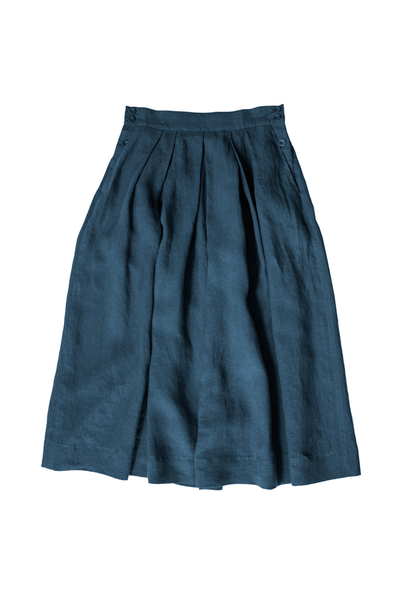 Shepherd Skirt laid on front of a plain surface