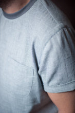 Load image into Gallery viewer, Close up of sleeve detail with small turn up. Also showing chest patch pocket
