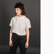 Load image into Gallery viewer, Lady wears a Tee Shirt with a stripe pattern and plain neckline, tucked into trousers
