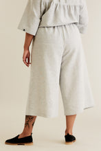 Load image into Gallery viewer, Back view of person stands wearing Ninni Culottes in a woven fabric
