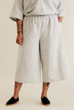Load image into Gallery viewer, Person stands wearing Ninni Culottes in a woven fabric
