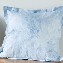 Load image into Gallery viewer, A cushion on a table made up with Nani Iro&#39;s Good Sign in Blue Cotton Linen Sheeting fabric
