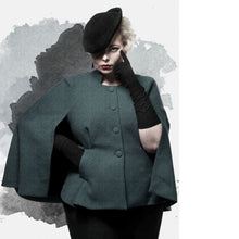 Load image into Gallery viewer, Illustration effect of lady wearing a jacket with cape, fastens at centre front with four buttons.
