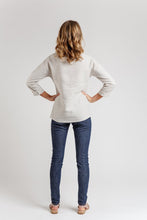 Load image into Gallery viewer, Back view of lady wearing Olive blouse, that sits below hip length
