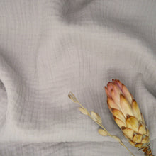Load image into Gallery viewer, Organic Cotton Double Gauze fabric slight crumpled with dried flowers laid on top
