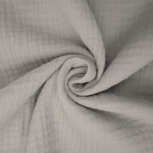 Load image into Gallery viewer, Organic Cotton Double Gauze fabric with central swirl shows soft handle
