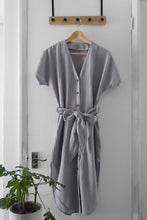 Load image into Gallery viewer, V-neck button front dress made from Organic Cotton Double Gauze fabric hangs on hanger
