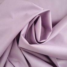 Load image into Gallery viewer, Close up of central twist in Organic Cotton Poplin fabric shows drape and structure
