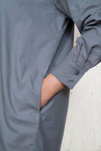 Load image into Gallery viewer, Front view of lady&#39;s hand in a pocket of the shirt.
