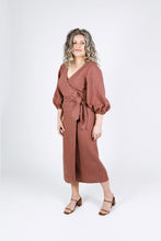 Load image into Gallery viewer, Side view of lady wearing Aura wrap dress with balloon sleeves and waist tie
