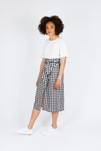 Load image into Gallery viewer, Side view of lady wearing Aura wrap skirt in gingham fabric

