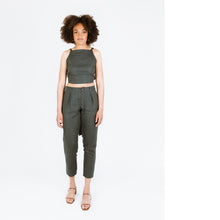 Load image into Gallery viewer, Lady wears shin length tapered trousers with inverted pleats at waistband
