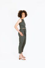 Load image into Gallery viewer, Side view of lady wearing Guise Pants with hand in side pocket
