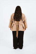 Load image into Gallery viewer, Back view shows lady wearing Juno Jacket with waist tie loosely tied at back
