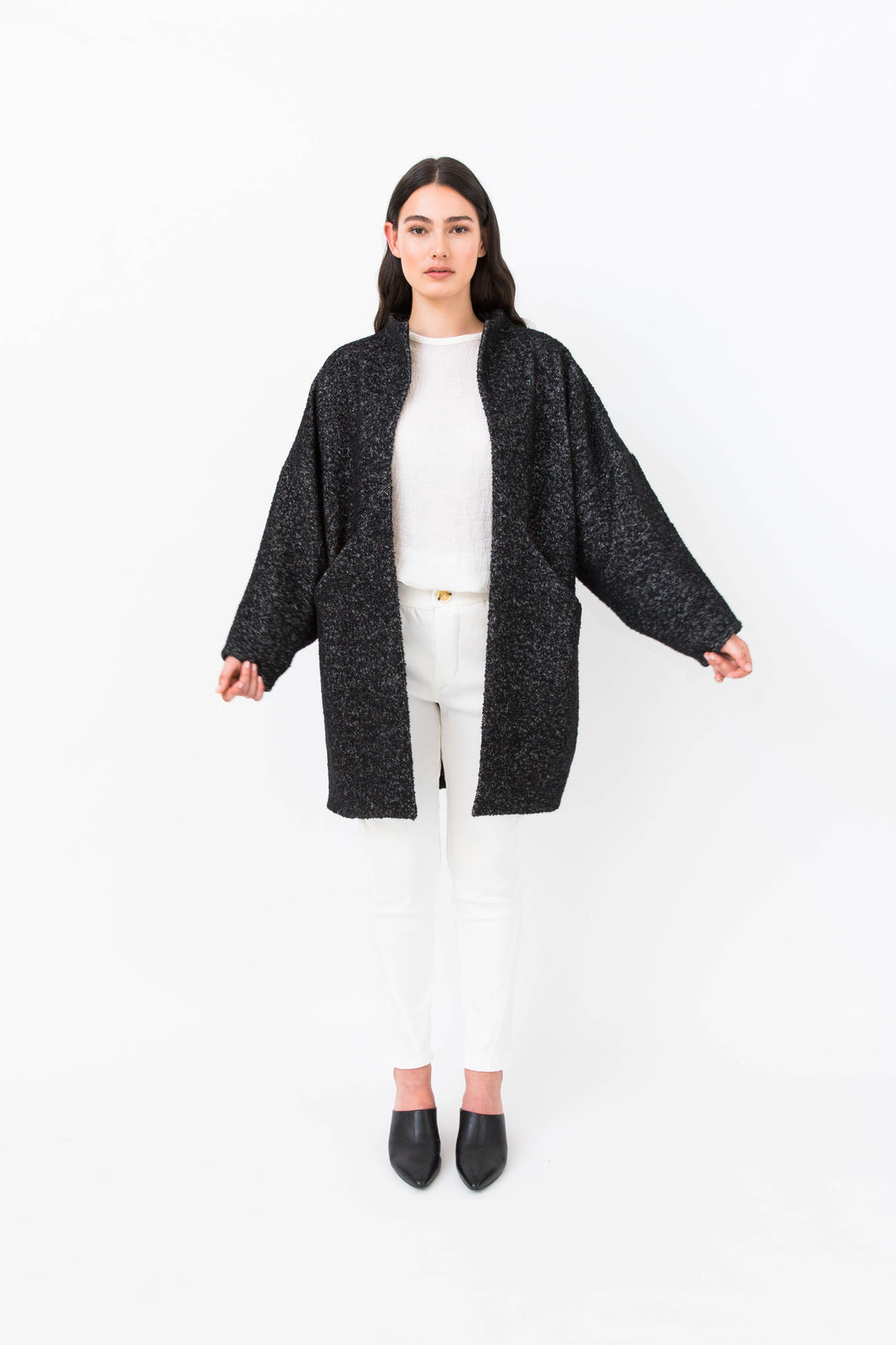 Lady wears Nova coat in a wool fabric