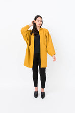 Load image into Gallery viewer, Lady wears a Nova Coat in bright colour
