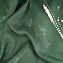 Load image into Gallery viewer, EcoVero fabric slightly crumpled with dried flower stems on top
