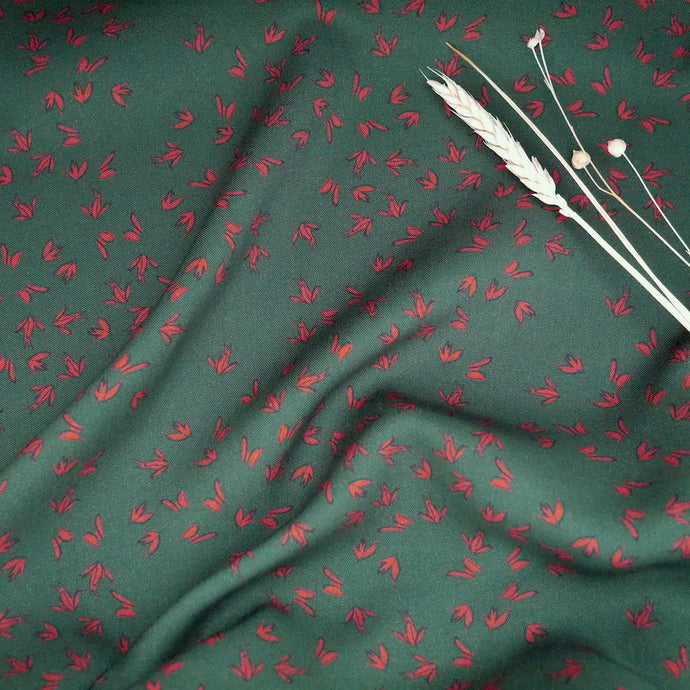 EcoVero Viscose Fabric slightly crumpled, displayed with dried flower stems on top