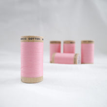 Load image into Gallery viewer, Five wooden reels of Scanfil Organic Cotton Thread in Carnation Pink
