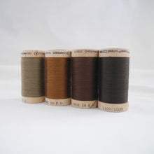 Load image into Gallery viewer, Four wooden reels of organic cotton sewing thread in Khaki, Acorn Brown, Mid Brown and Dark Brown colours
