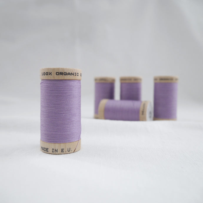 Five wooden reels of Scanfil Organic Cotton Thread in Lavender