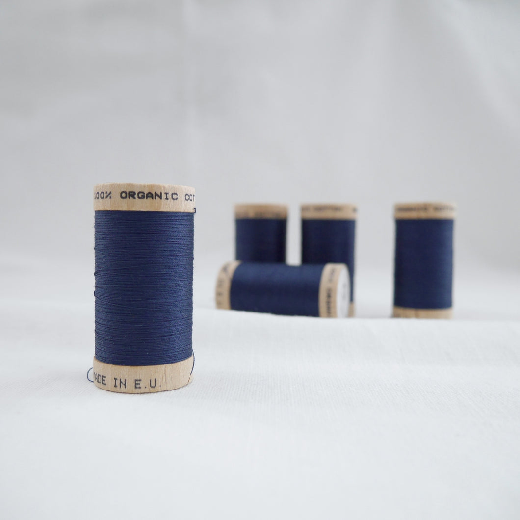 Five wooden reels of Scanfil Organic Cotton Thread in Sapphire