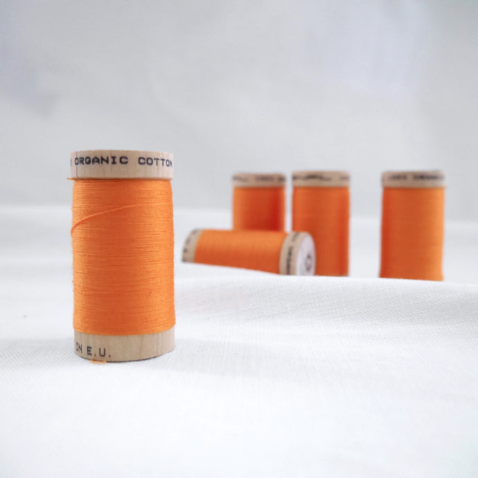 Five wooden reels of Organic Cotton Sewing Thread