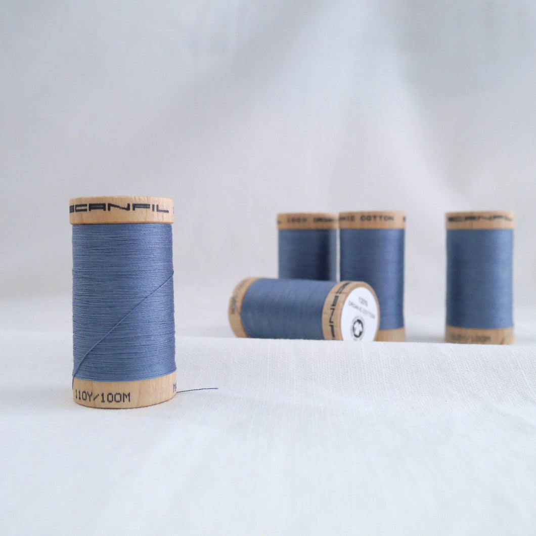 Five wooden reels of Scanfil Organic Cotton Thread in Dusk