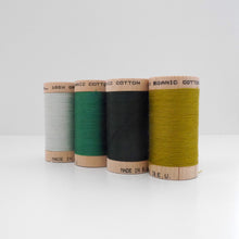 Load image into Gallery viewer, Four wooden reels of Organic Cotton Sewing Thread in different colours
