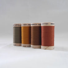 Load image into Gallery viewer, Four wooden reels of organic cotton sewing threads in khaki, gold ochre, acorn brown and copper colours
