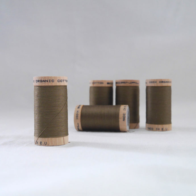 Five wooden reels of Organic Cotton Sewing thread in Khaki Brown colour