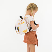 Load image into Gallery viewer, Side view of young girl wearing summer shorts made of Flecks fabric

