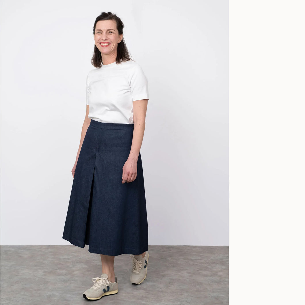 Lady stands wearing wide-legged culottes that could be mistaken as a skirt