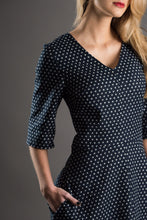 Load image into Gallery viewer, Close up of V-neck collar and elbow length sleeves  on The A-Line Dress
